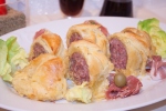 italian cotechino sausage rolls in puff-pastry side view close-up